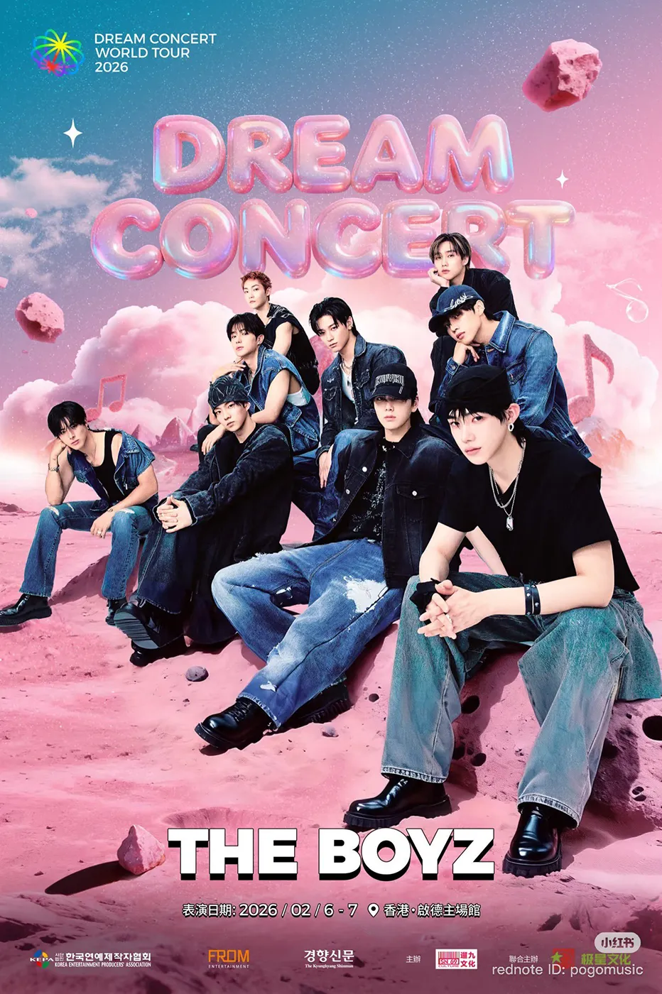 Event poster for Dream Concert 2026 World Tour featuring The Boyz, showcasing group members seated and standing on a pink rocky landscape with colorful clouds and musical notes in the background.