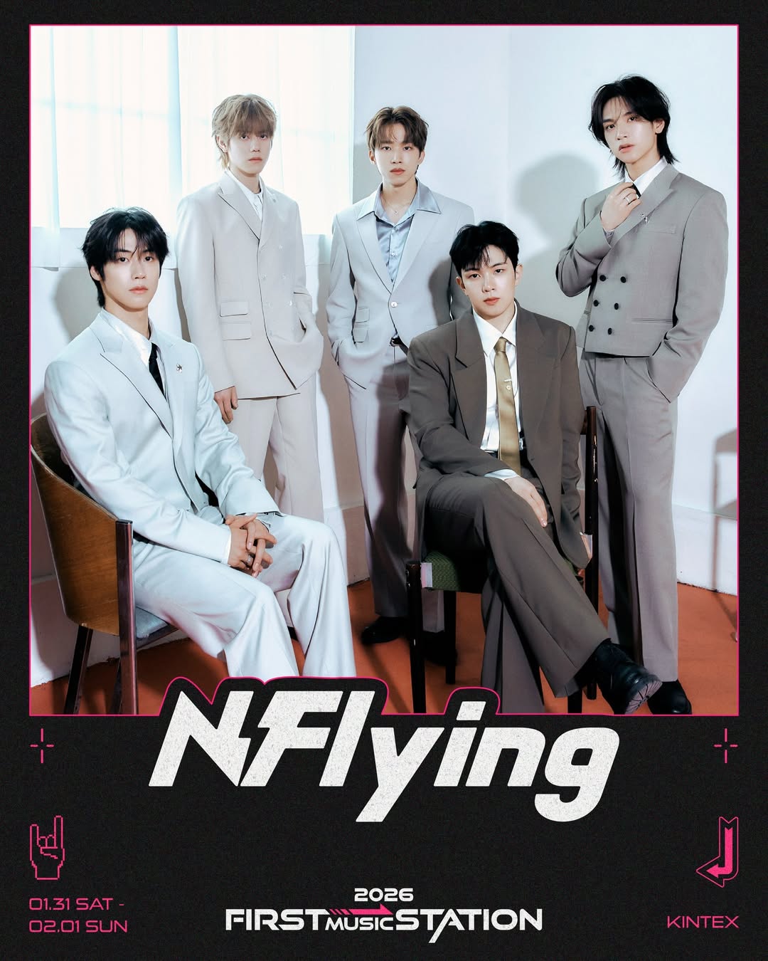 A promotional image featuring five members of the band N.Flying dressed in stylish suits, posing together in a bright room with large windows.