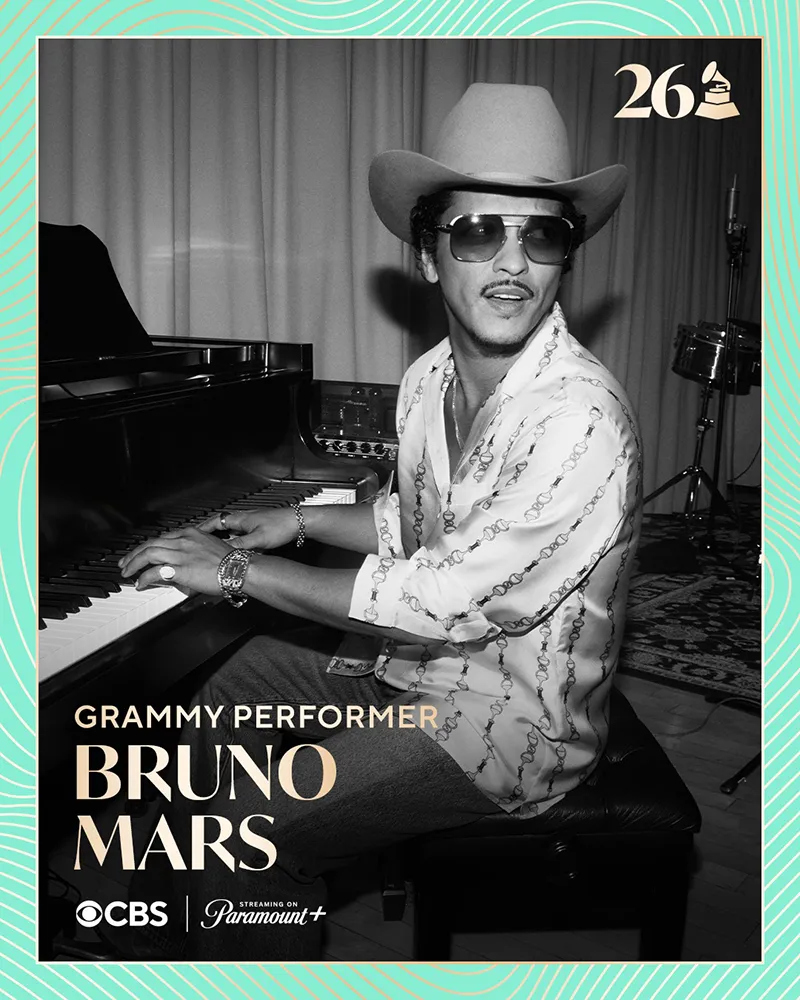 A man playing the piano wearing sunglasses and a wide-brimmed hat, with text highlighting him as a Grammy performer.