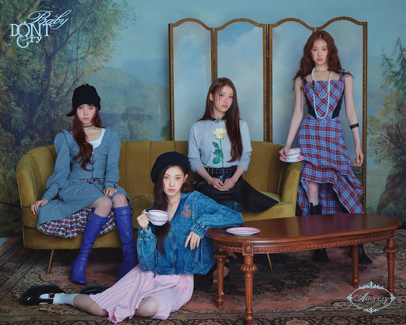 Four members of Baby DONT Cry dressed in stylish outfits pose in a vintage setting with a patterned backdrop and a brown sofa. One woman holds a teacup, while the others sit or stand beside her. This teaser is for their Mini Album After Cry (2026)