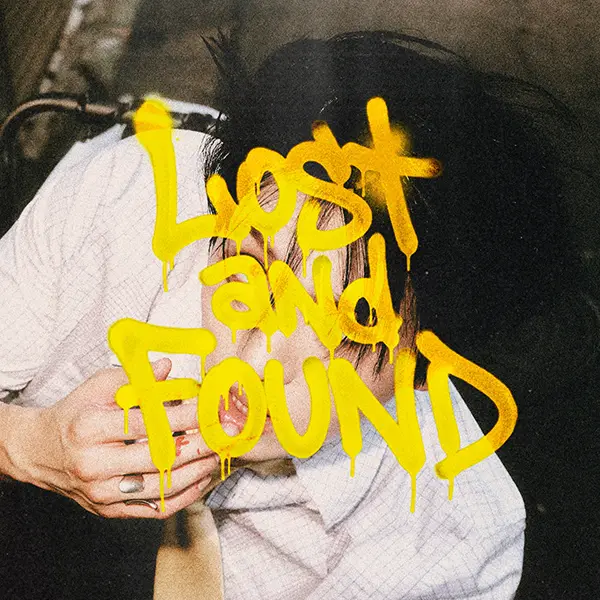 KINO 3rd EP Lost and Found. An artistic image featuring the phrase 'Lost and Found' in bold, dripping yellow graffiti over a background showing a person with dark hair, partially obscured.