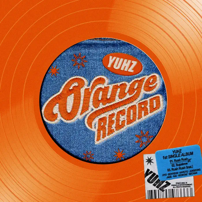 An orange vinyl record featuring a denim patch design labeled 'YUHZ Orange Record' album cover with track listings and a barcode sticker.